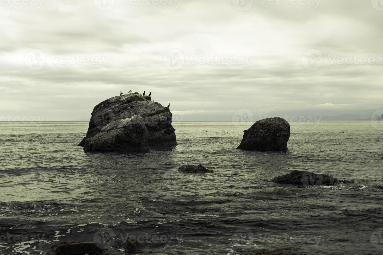 big stone in the sea photo