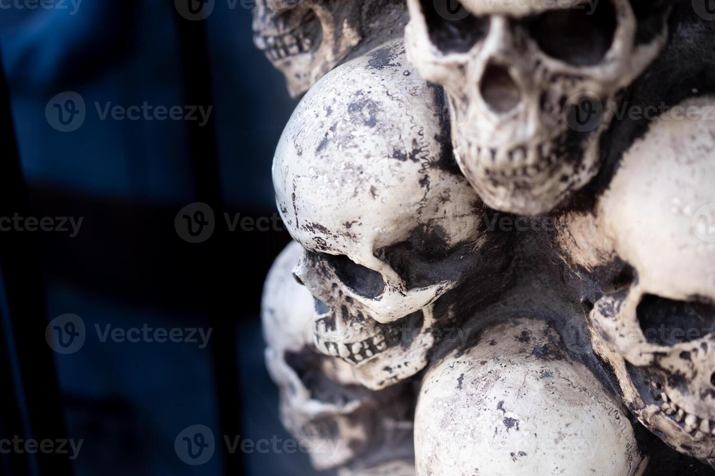 Skull Halloween Background Many People Skulls Stand on top of each other. Mystic creepy concept. Abstract nightmare occult memorial photo