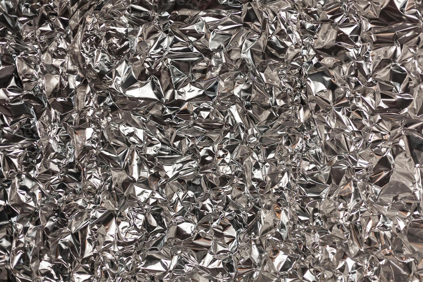 Full frame take of a sheeT of crumpled silver aluminum foil photo