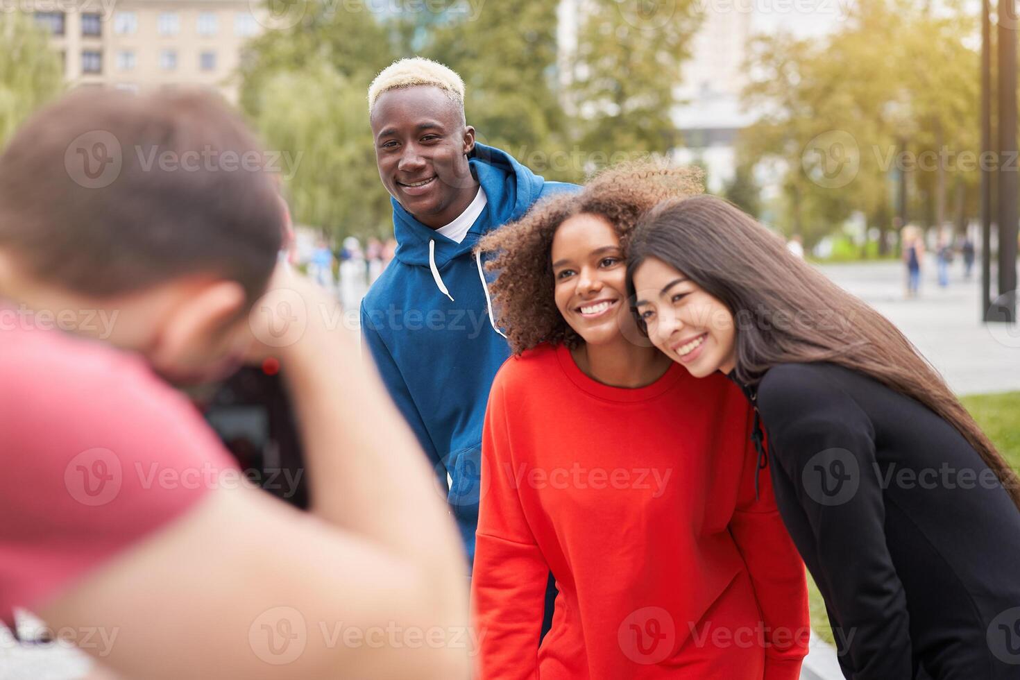 Multi ethnic friends outdoor. Diverse group people Afro american asian spending time together photo