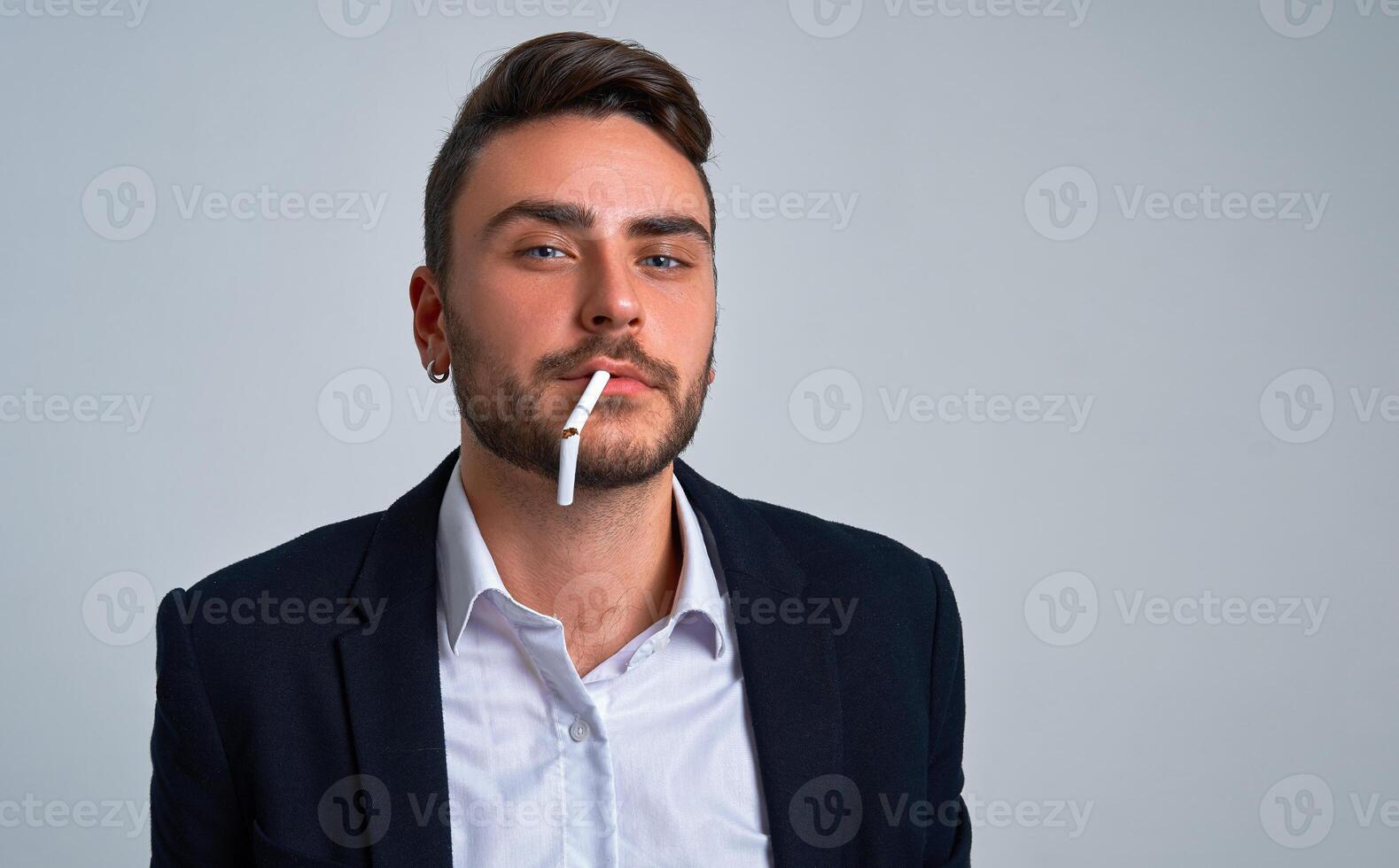 Close up portrait young man businessman. Caucasian guy business suit studio gray background. photo