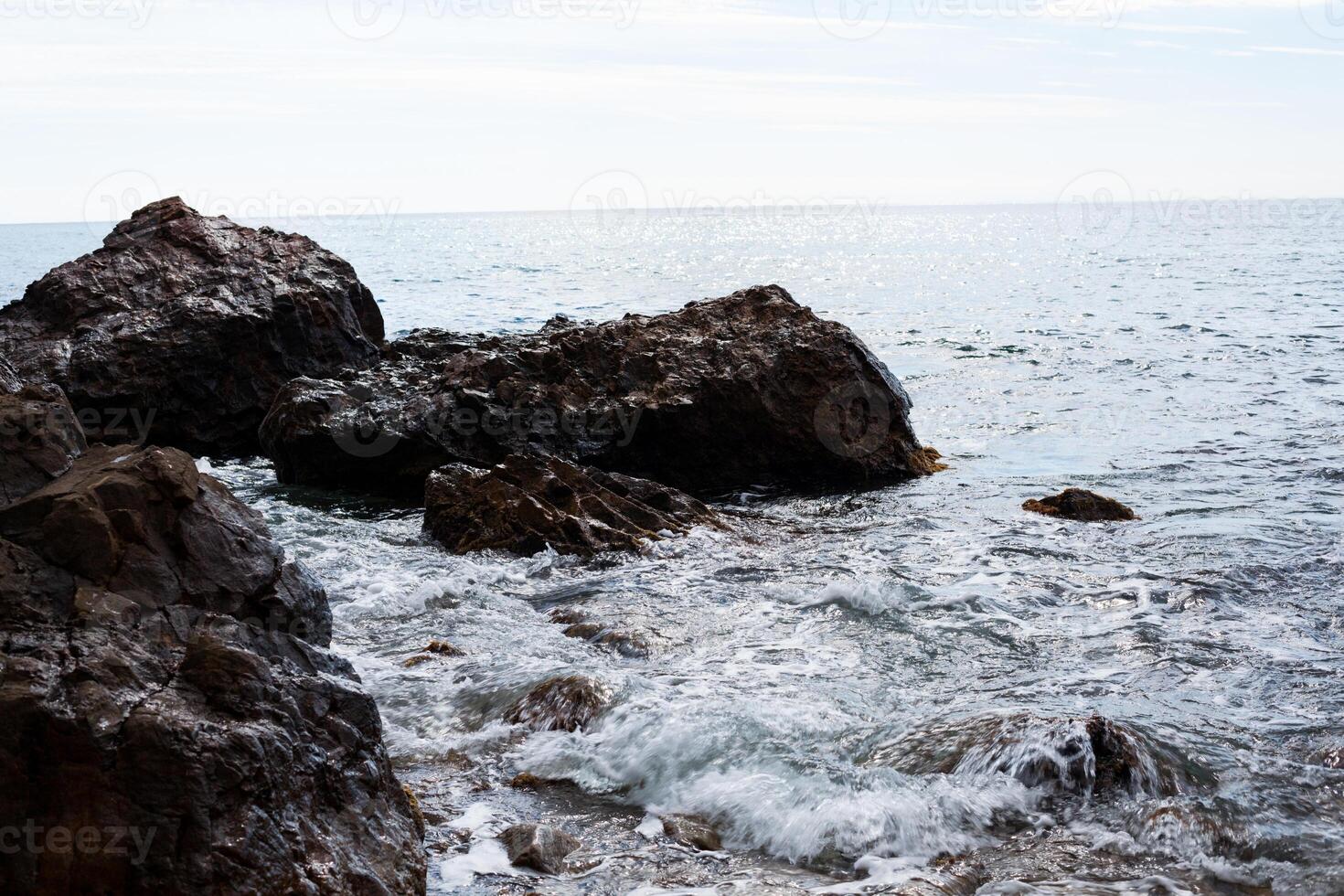 stone in the sea or ocean photo