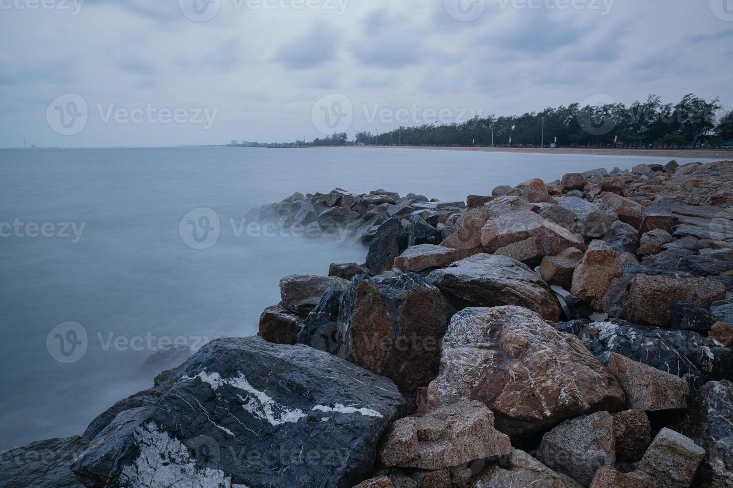 Rock breakwater in the sea in the morning photo