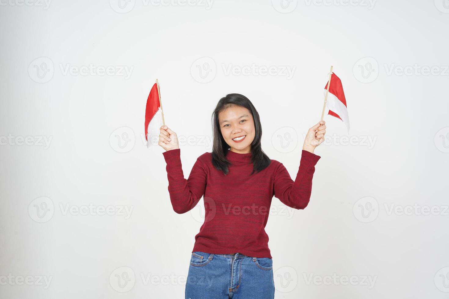 Young Asian woman in Red t-shirt Holding Indonesian flag, Independence day concept isolated on white background photo