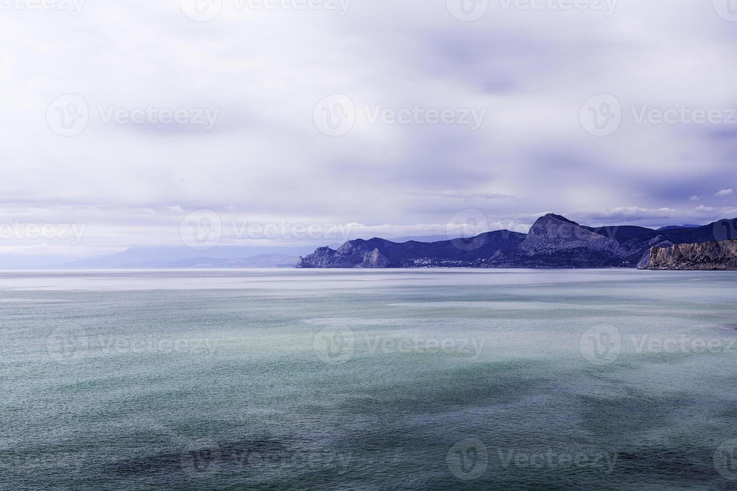 seascape mountains on the horizon on a sunny day photo