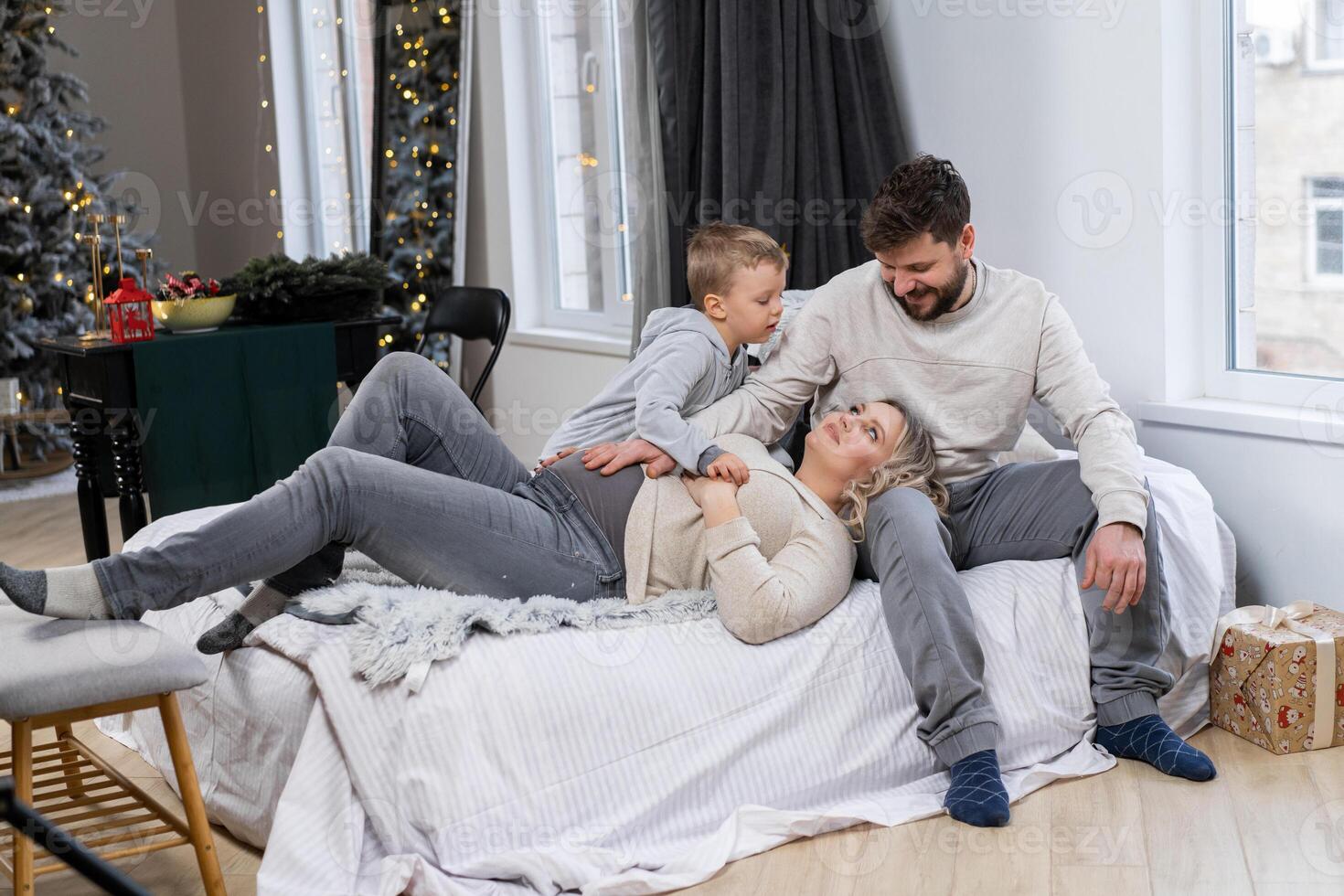 Happy family concept Mother father and son have fun at home photo