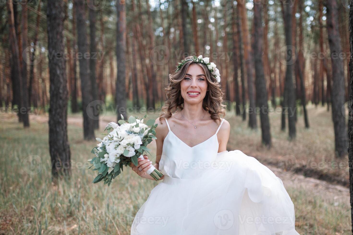 Full length side view of one beautiful sensual young blonde bride in long white wedding dress photo