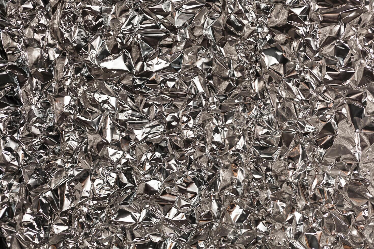 Full frame take of a sheeT of crumpled silver aluminum foil photo