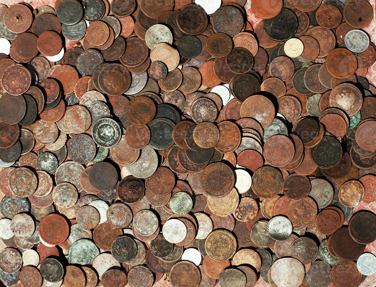 collection of bronze coins as a texture at a flea market photo