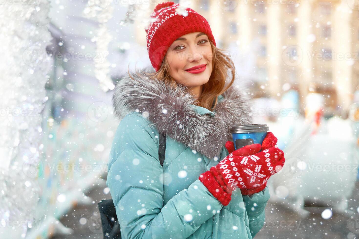 Beautiful lovely middle-aged girl with curly hair warm winter jackets stands background Town Square. photo