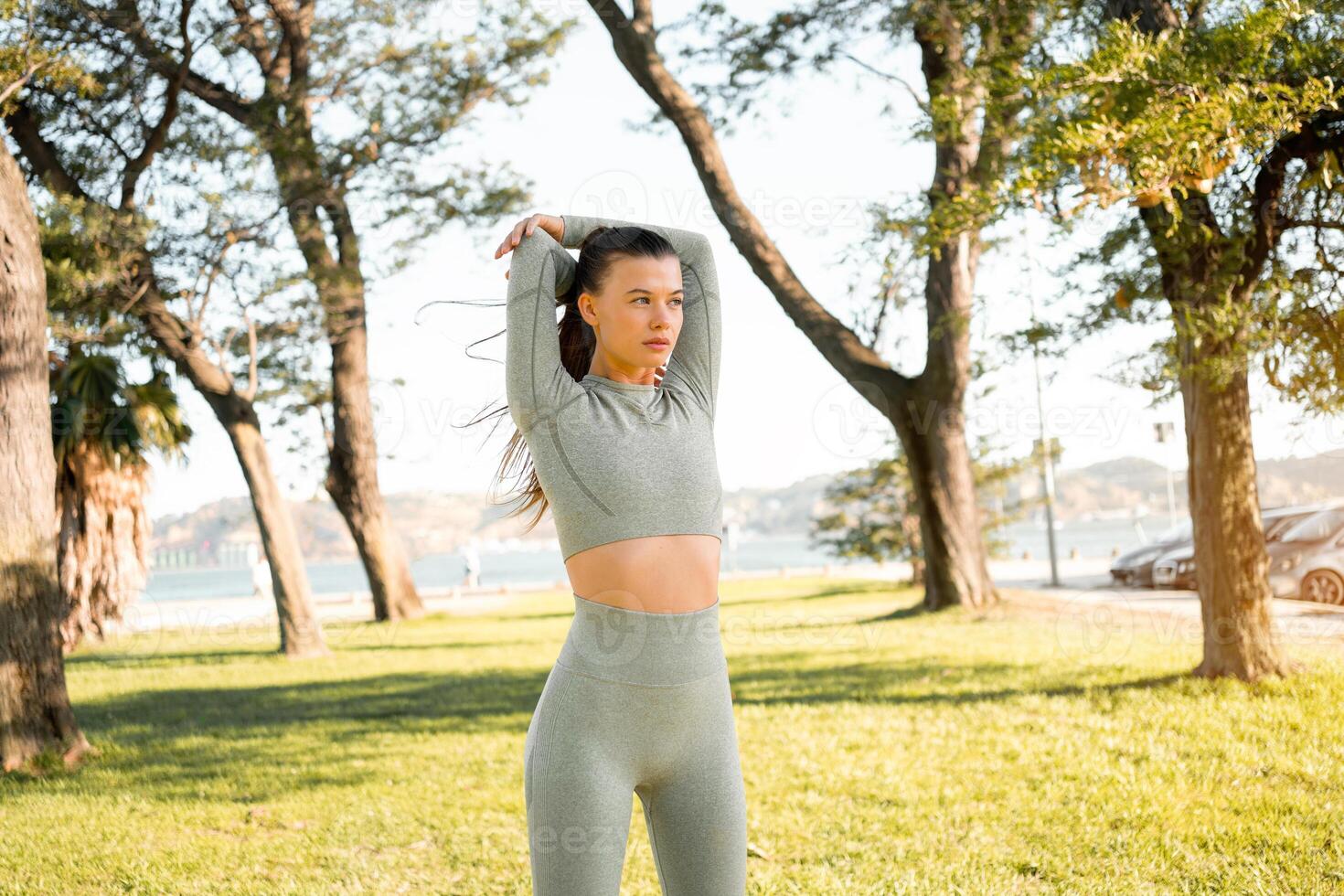 Woman Stretching And Warming-Up Before Running photo