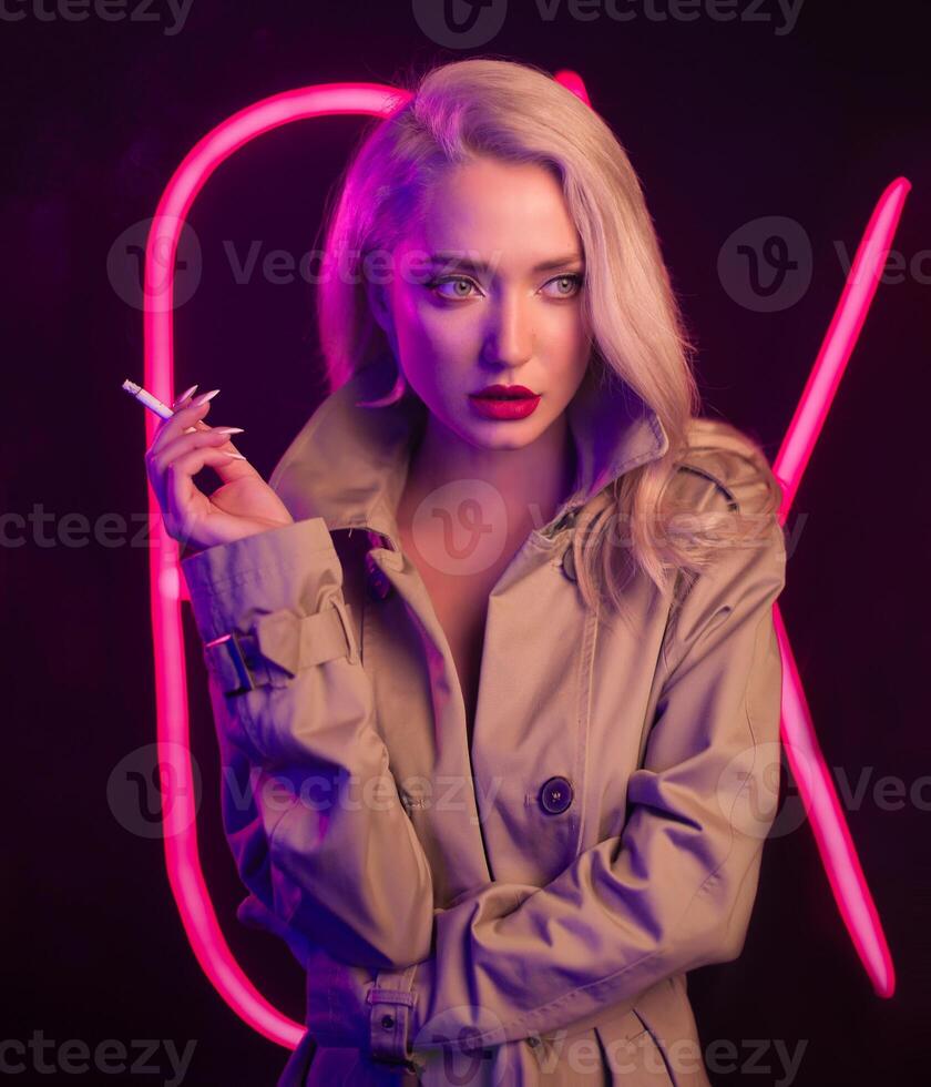 Fashion art photo of elegant model in seductive wear with light neon colored club spotlights