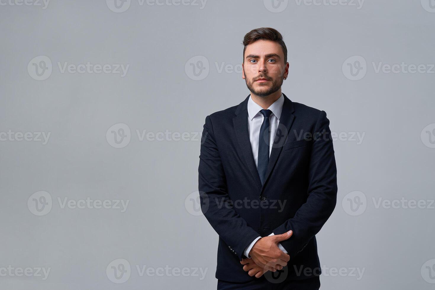 Close up portrait young man businessman. Caucasian guy business suit studio gray background. photo