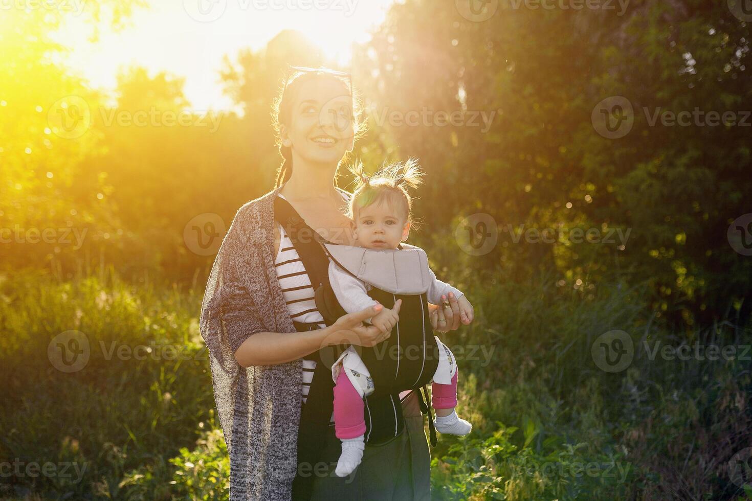 Portrait of baby girl and gorgeous mother. photo