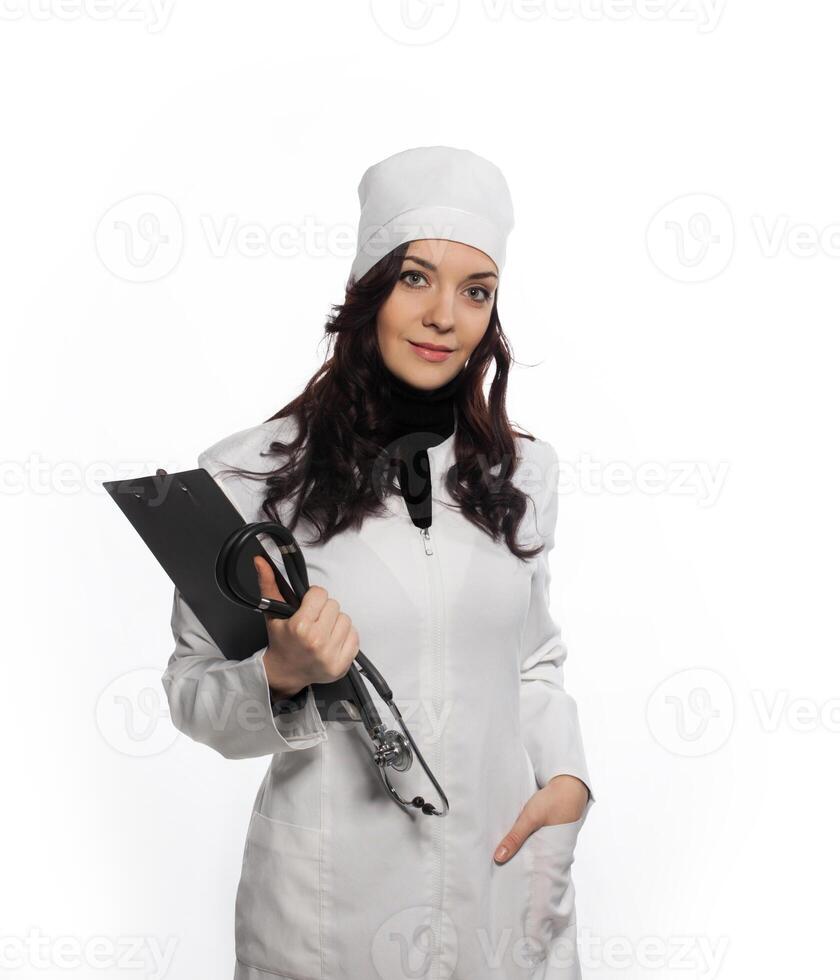 a woman in a white lab coat holding a clipboard photo