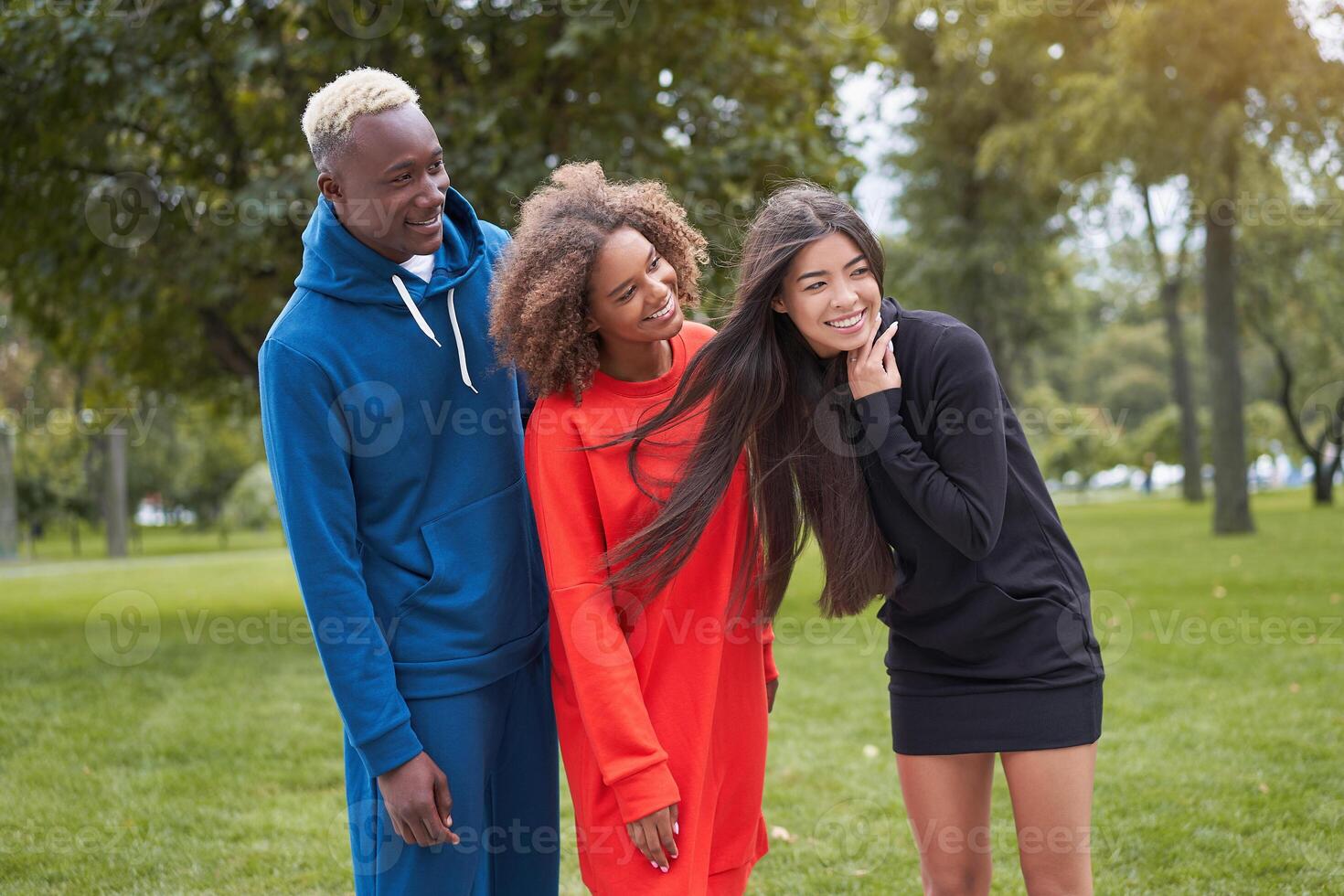 Multi ethnic friends outdoor. Diverse group people Afro american asian spending time together photo