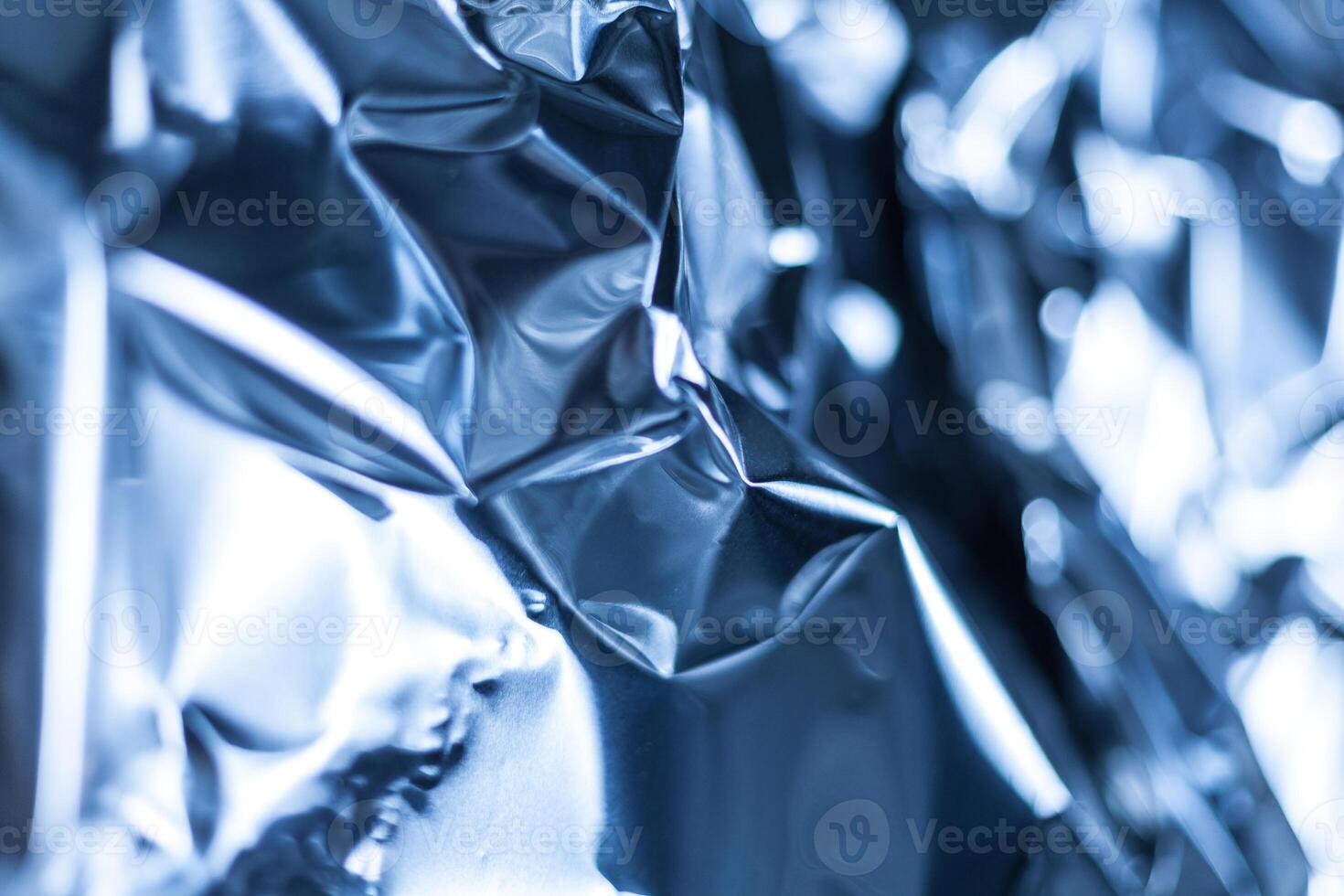 Full frame take of a sheeT of crumpled blue aluminum foil photo