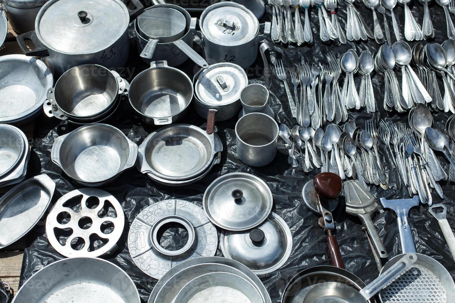 aluminum cookware for sale at a flea market photo