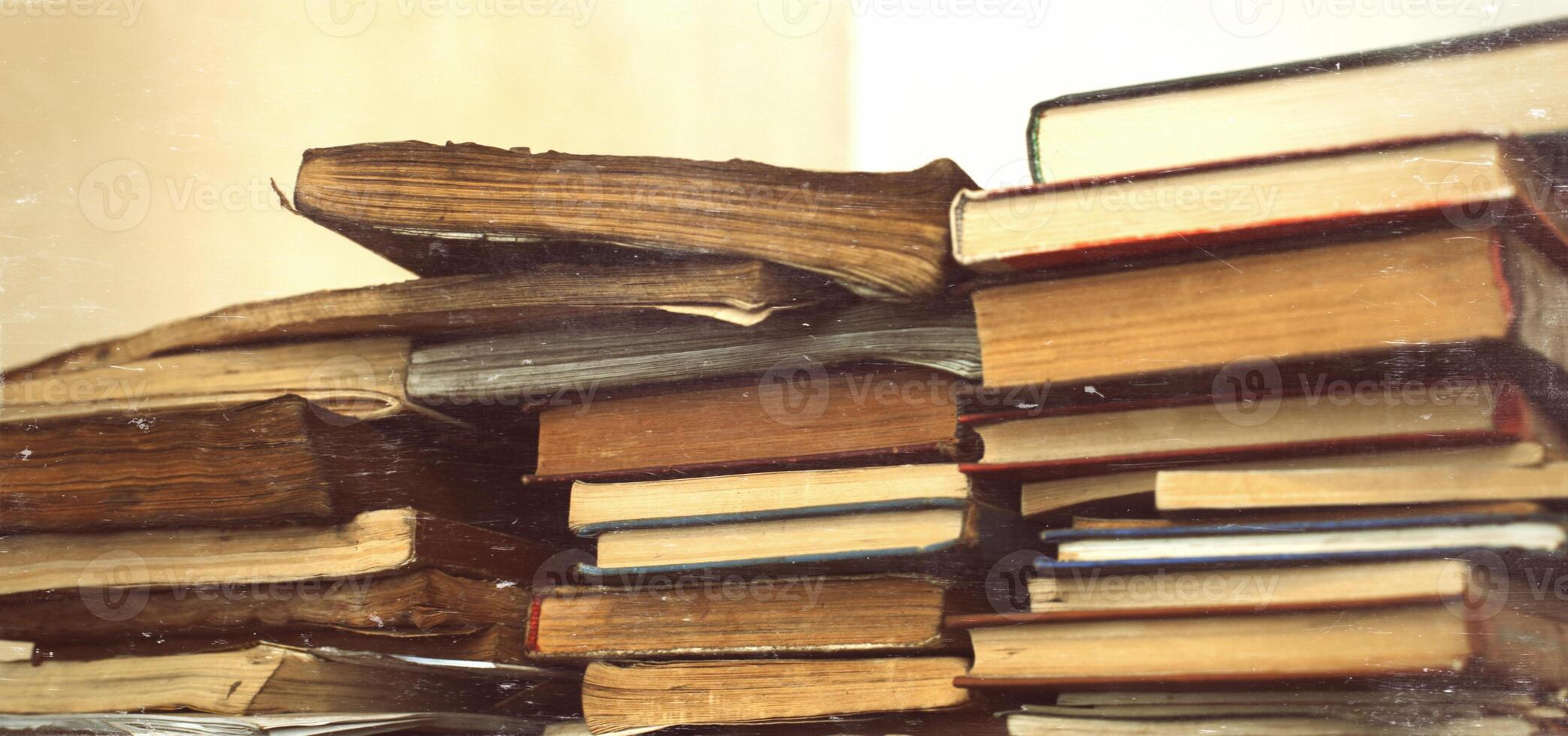 many vintage old dirty books in three stack photo