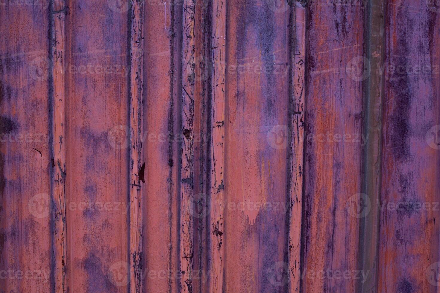 Grunge metal background. Detail of the paint peeling from a metallic container. photo