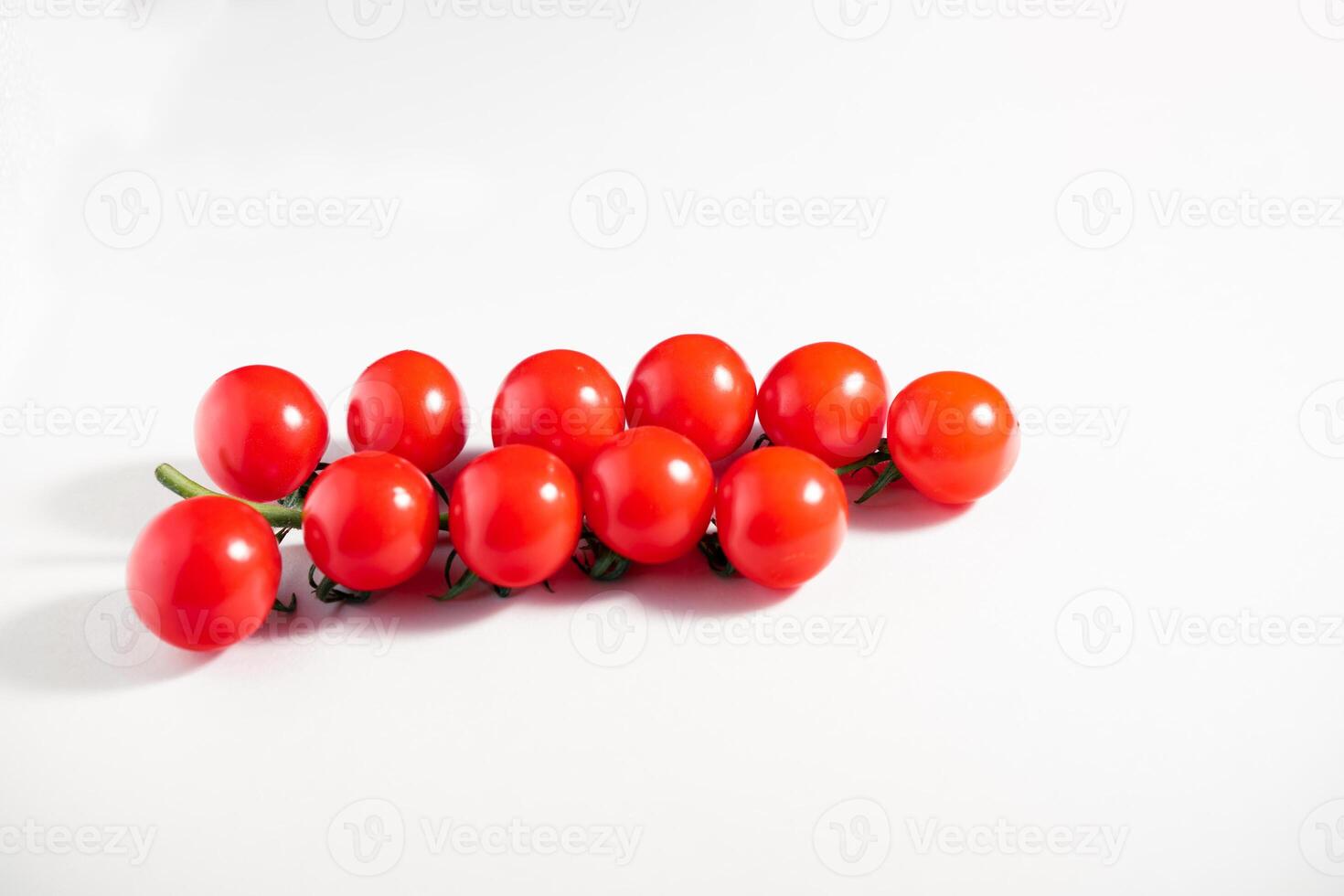 Cherry tomatoes isolated on the white background photo