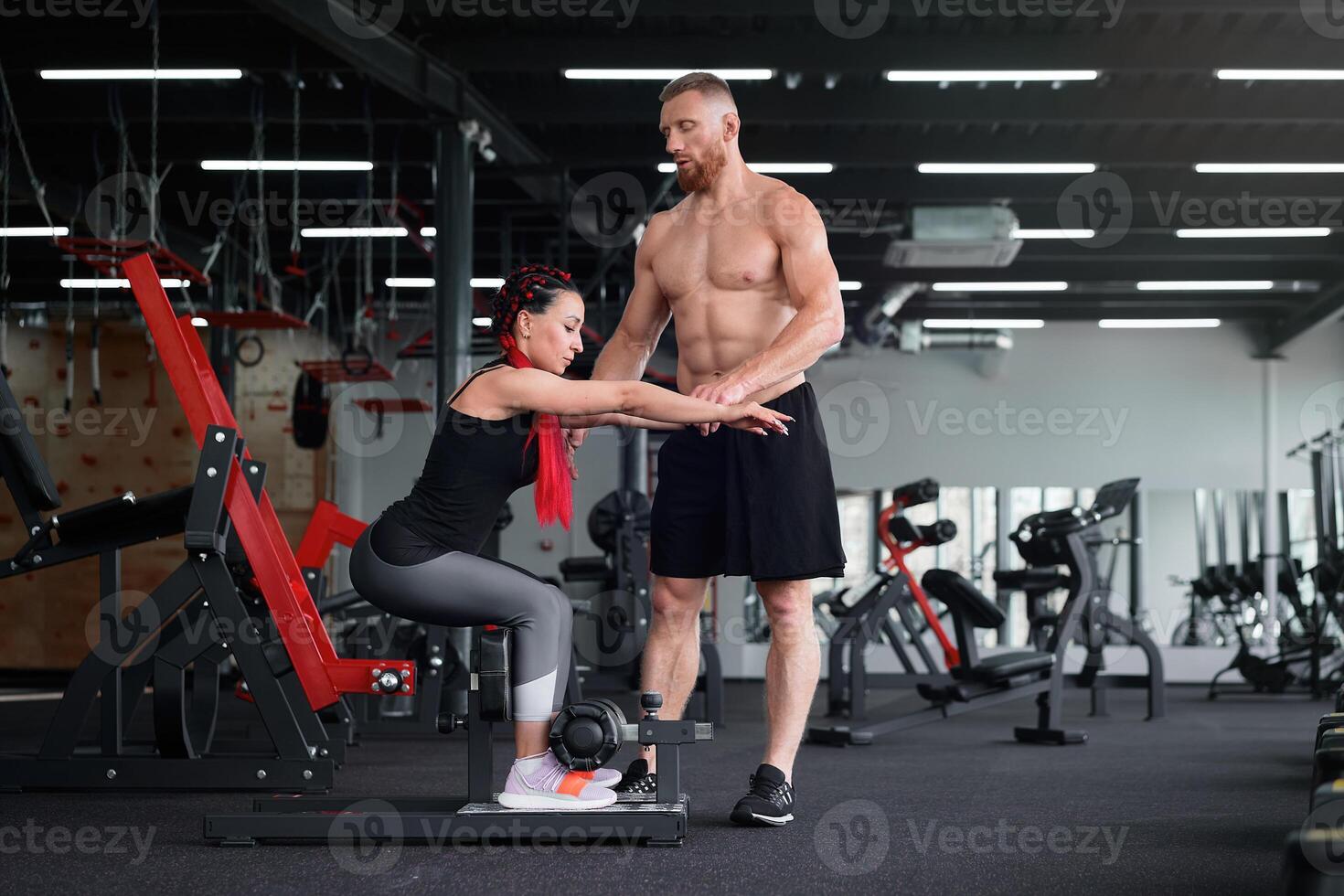 Personal trainer coach instructor athlete sportive man woman gym Boyfriend girlfriend training together photo
