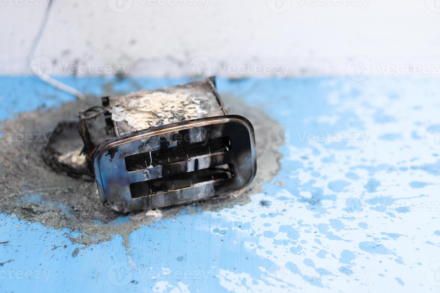 Toaster after fire. Household electrical appliance fire hazard photo