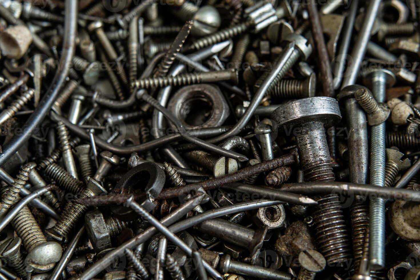 Range Rusty old screws bolts nuts. Grunge metal Hardware details photo