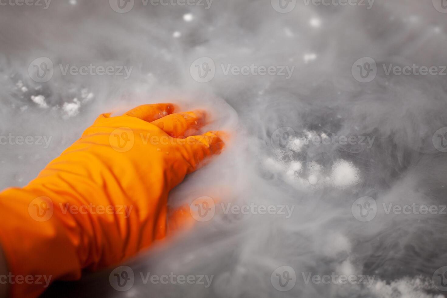 Thick white smoke on a background of black ceramic tiles. photo