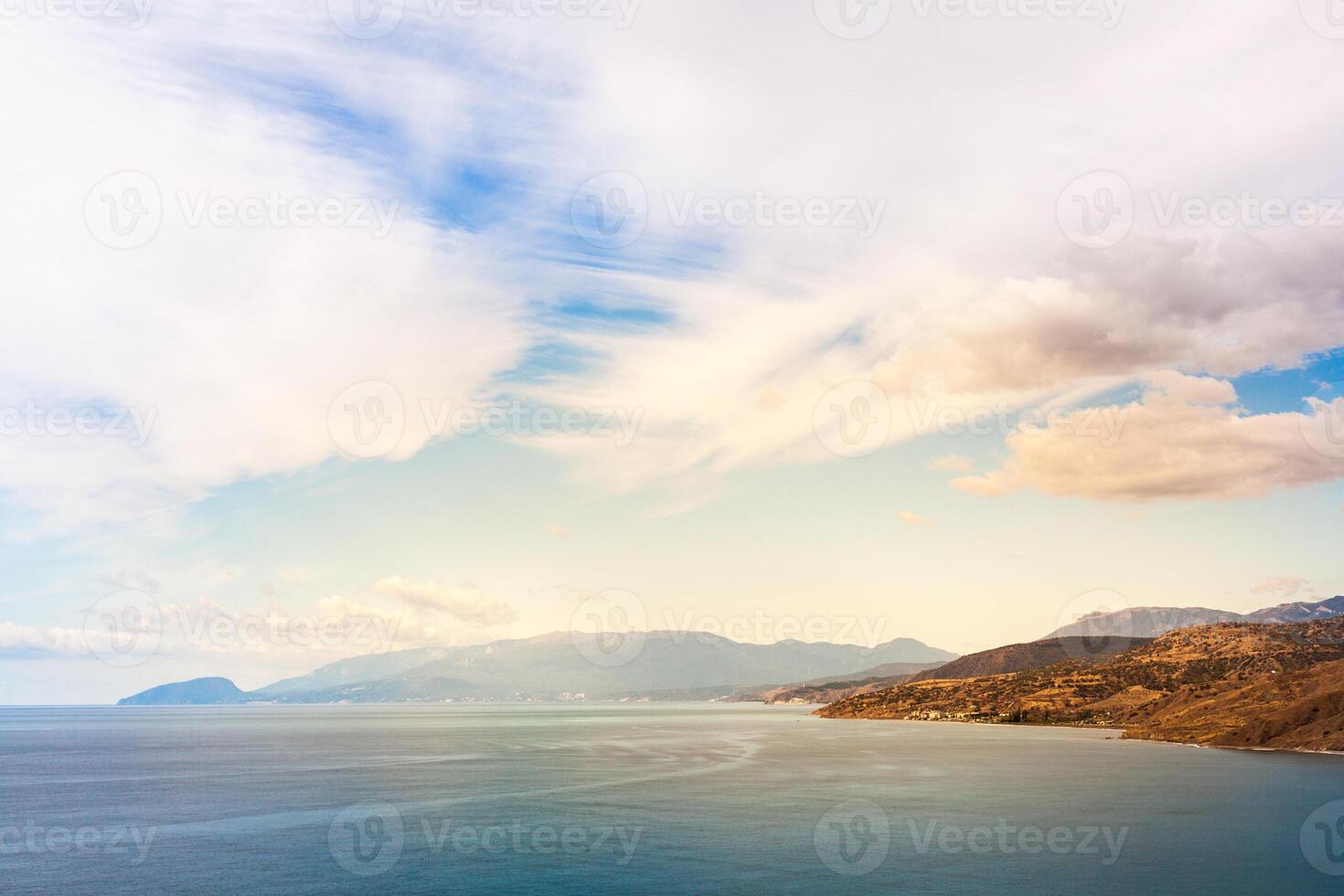 seascape mountains on the horizon on a sunny day photo