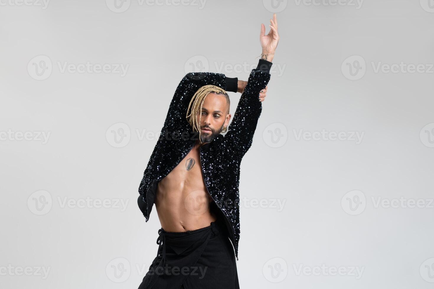 Gay man wearing skirt dancing photo