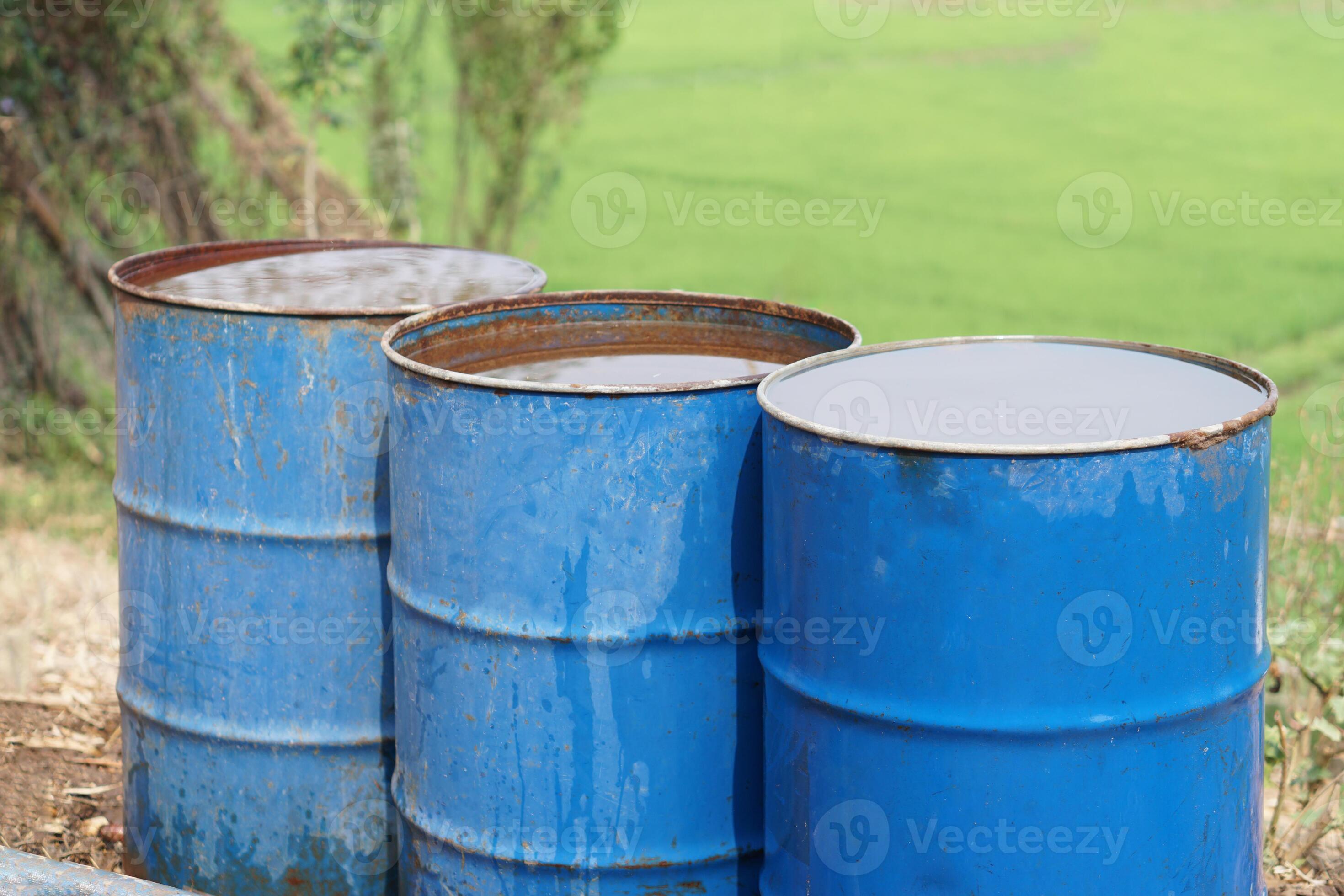 Blue buckets contain water in garden. Concept, Solve problems lacking