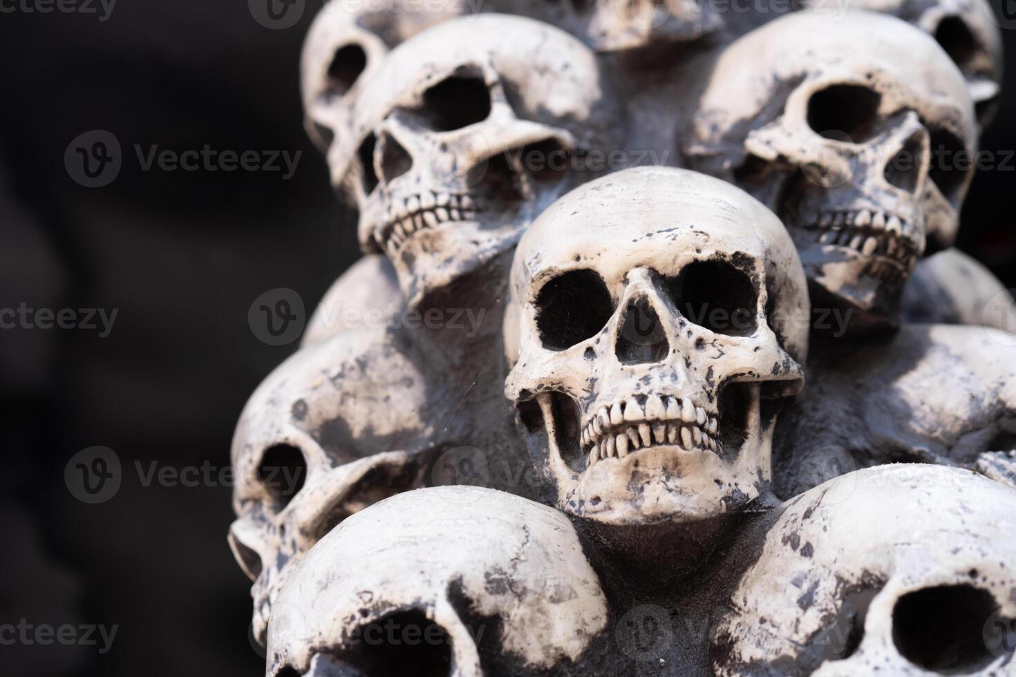 Skull Halloween Background Many People Skulls Stand on top of each other. Mystic creepy concept. Abstract nightmare occult memorial photo