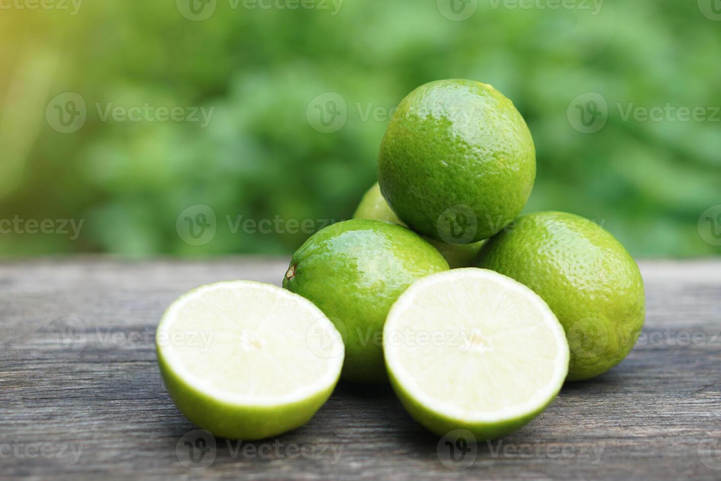Green organic lime fruits. Concept, herbal fruits with sour taste, can be cooked as food seasoning or making beverage such as lemonade or juice, provide vitamin C. photo