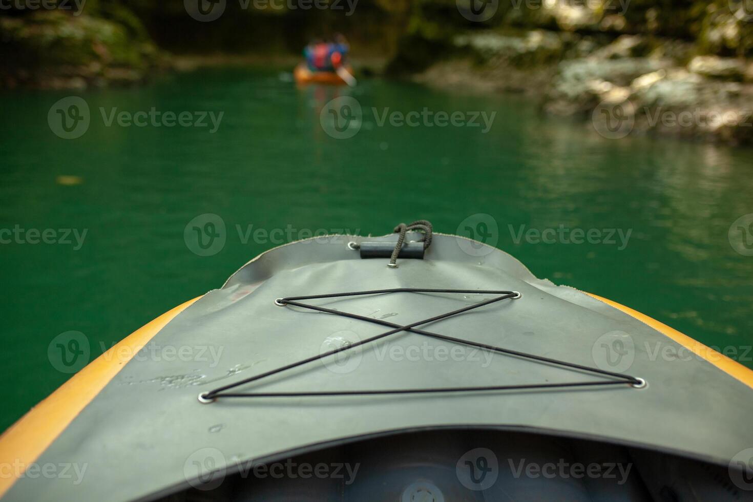 Kayaking on the river. group of people in a boat sailing along the river. Rowers with oars in a canoe. Rafting on a kayak. Leisure. photo