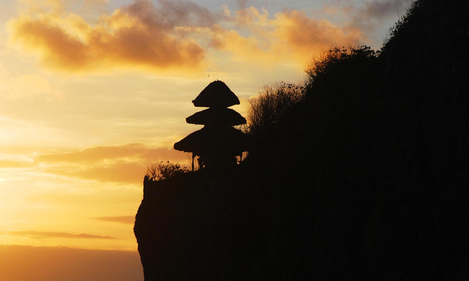 background of the silence of Nyepi day with the temple at sunset photo