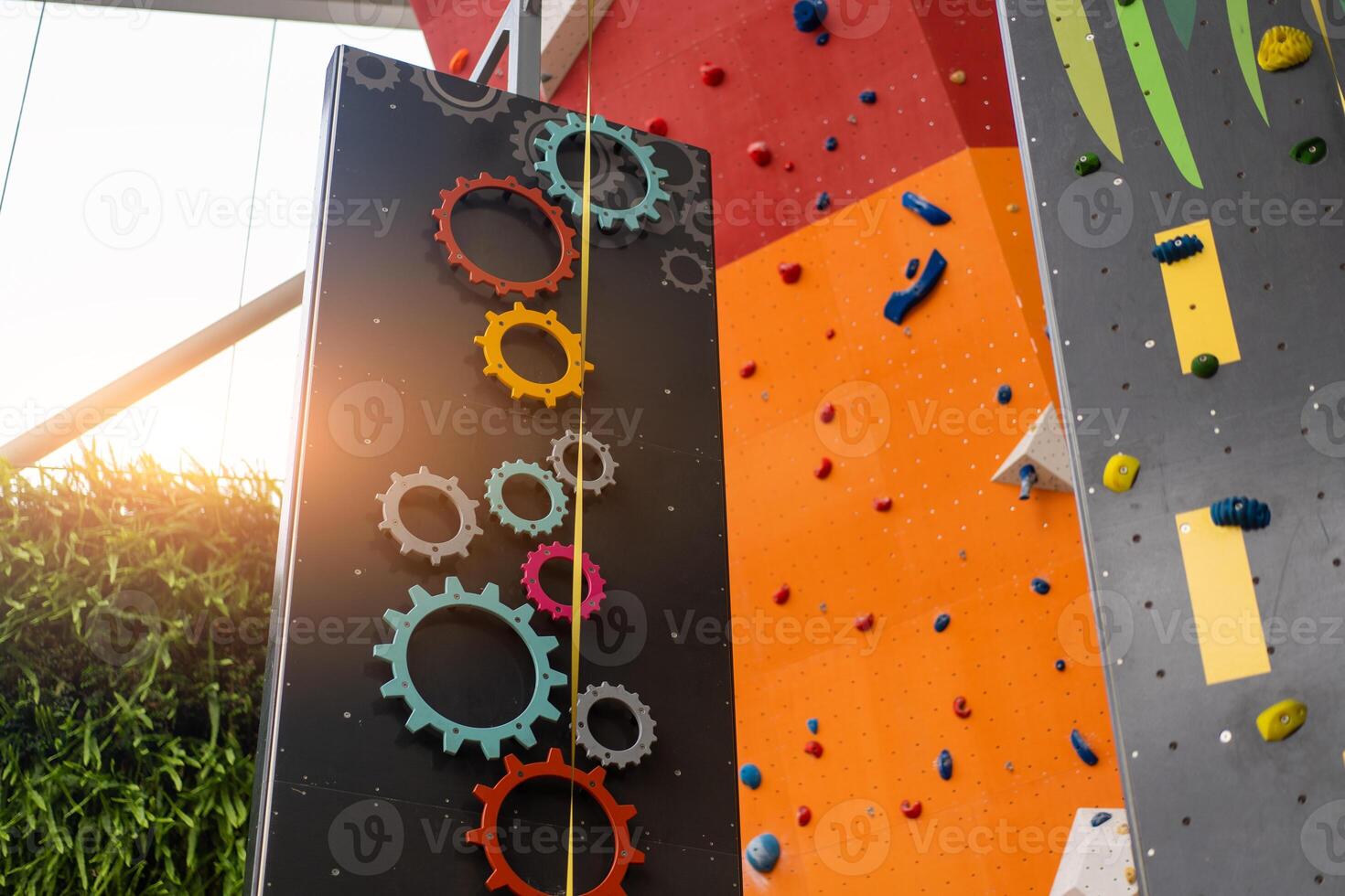 Indoor bouldering and climbing wall for training at modern gym. Gears and toy climbing wall for children photo