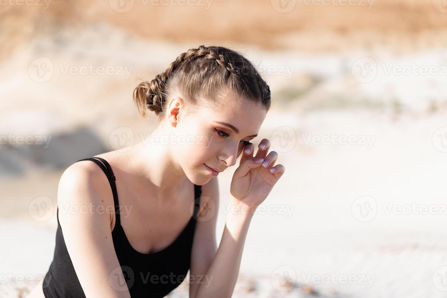 Close up portrait of a sad and depressed woman deep in thought outdoors. photo