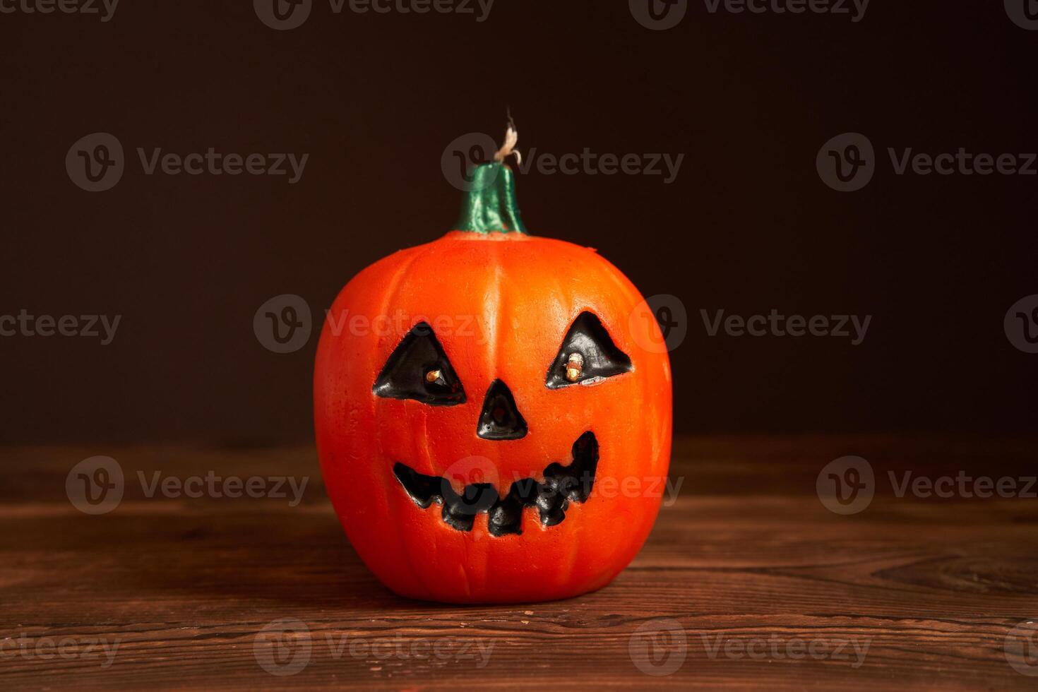 Halloween background, orange decorative plastic pumpkin black paper Thanksgiving greeting card photo