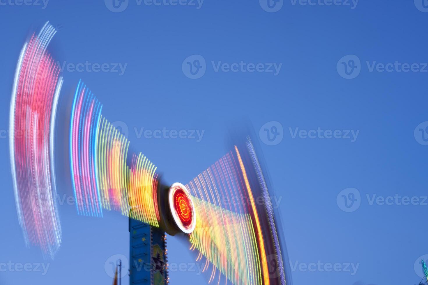 Amusement park blurred effect. Abstract illuminated background photo