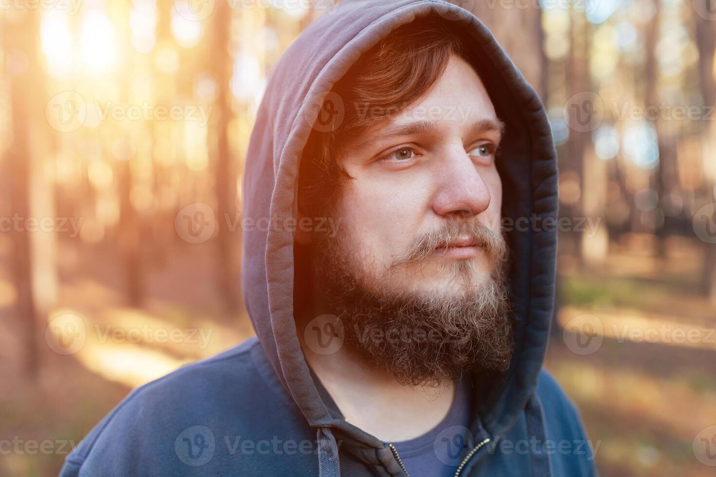 portrait hipster tourist man with beard and tourist in the woods forest photo