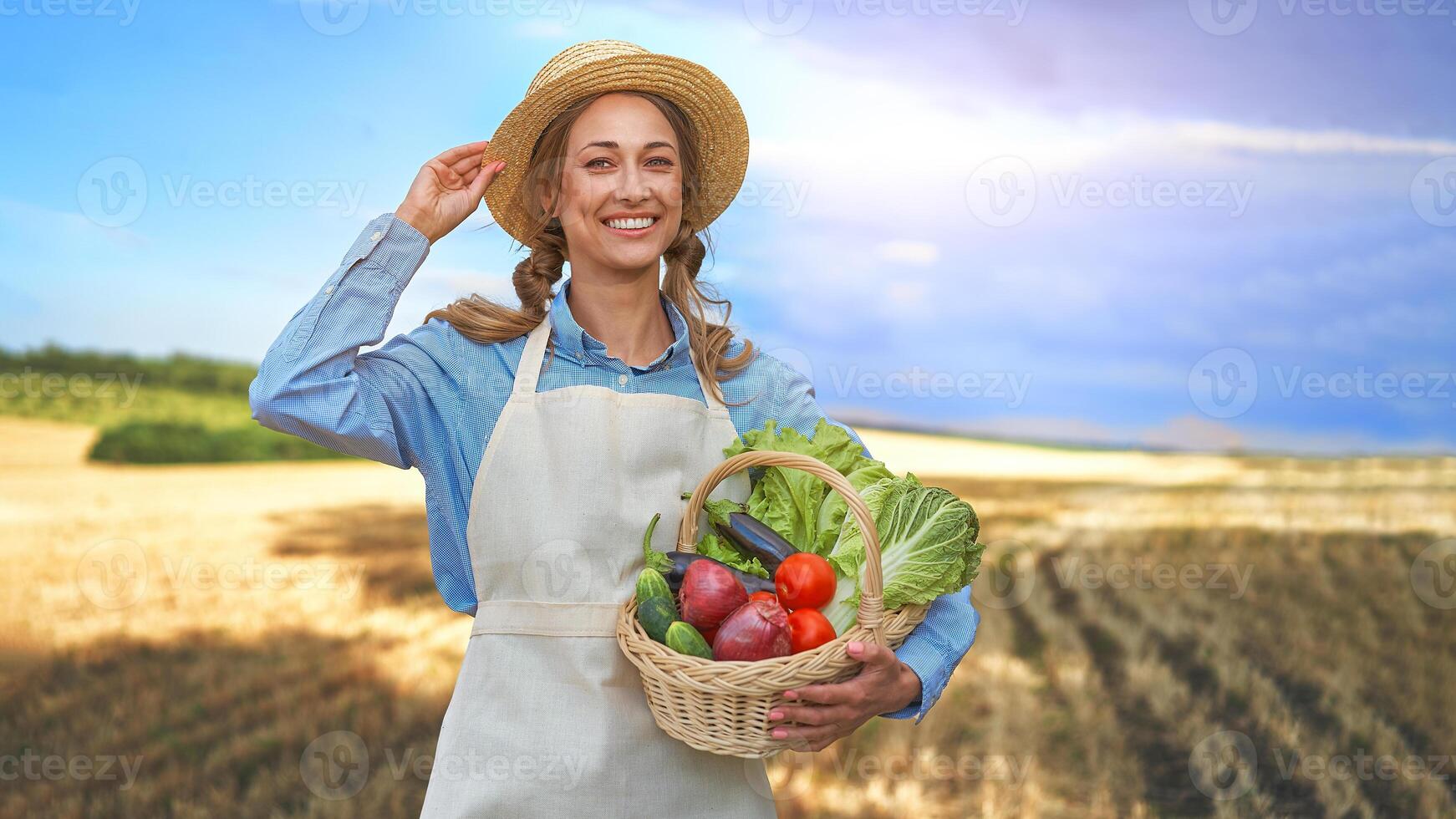 Woman farmer straw hat apron standing farmland smiling Female agronomist specialist farming agribusiness Happy positive caucasian worker agricultural field photo