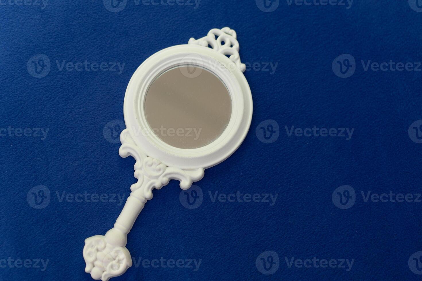 Vintage style white women hand mirror with decoration, women gadget, beauty concept photo