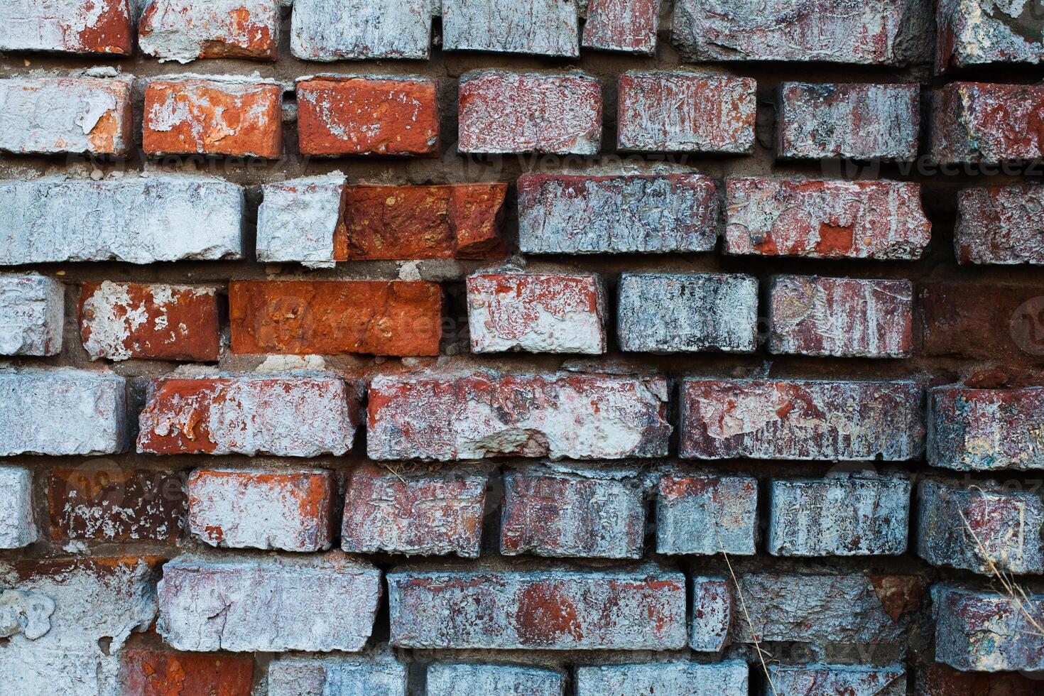 Fragment of old grunge stone wall photo
