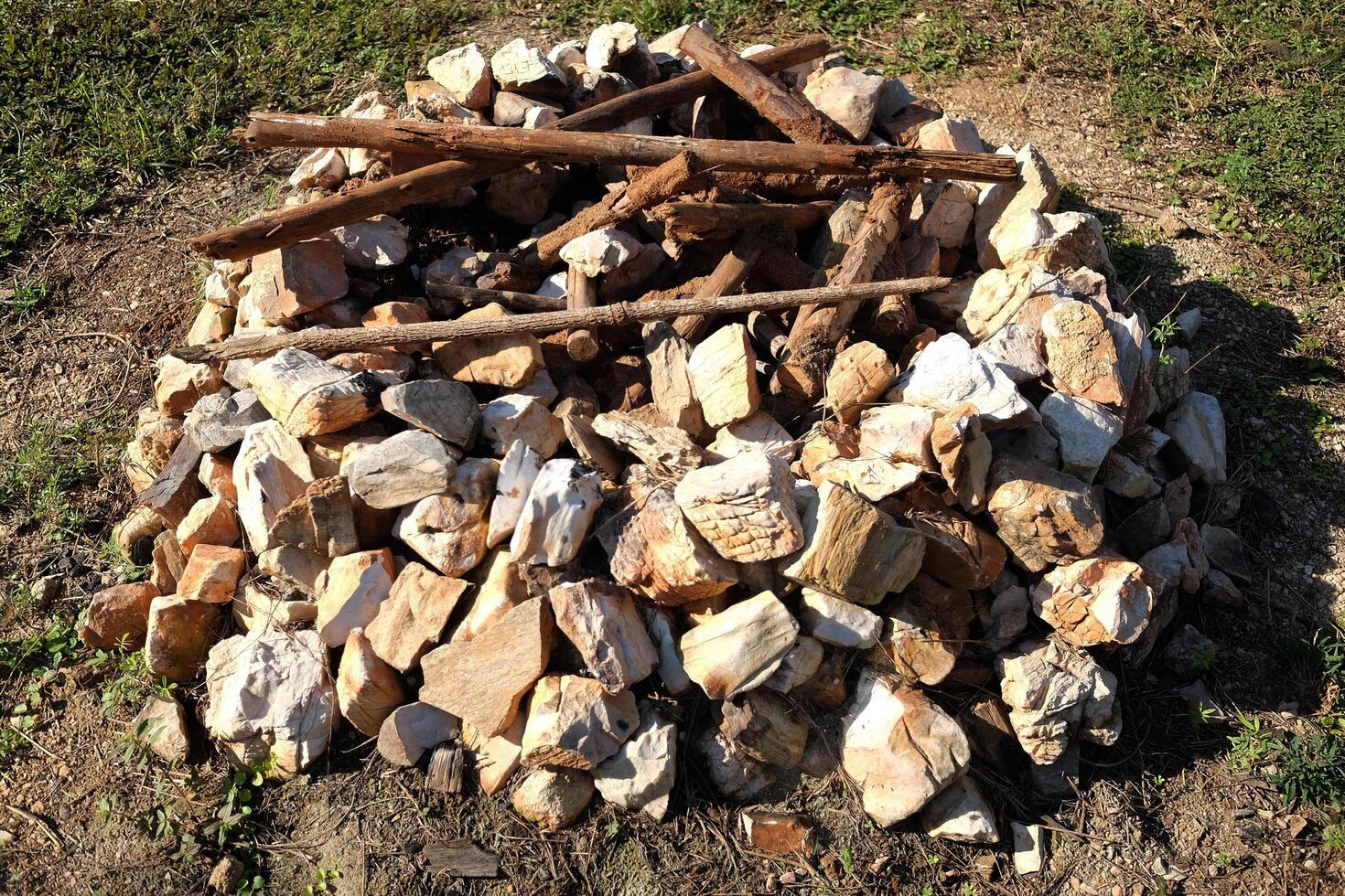 Stone or rocky and dry branch for make camping bonfire photo