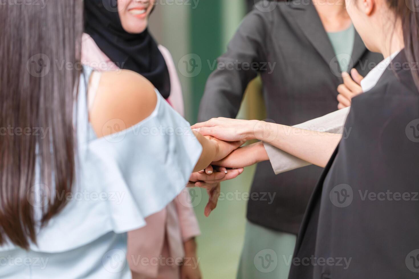 Success Teamwork Concepts, Business people with joined hands as a team, Group of diverse hands together joining, Young businesswomen team putting their hands together photo