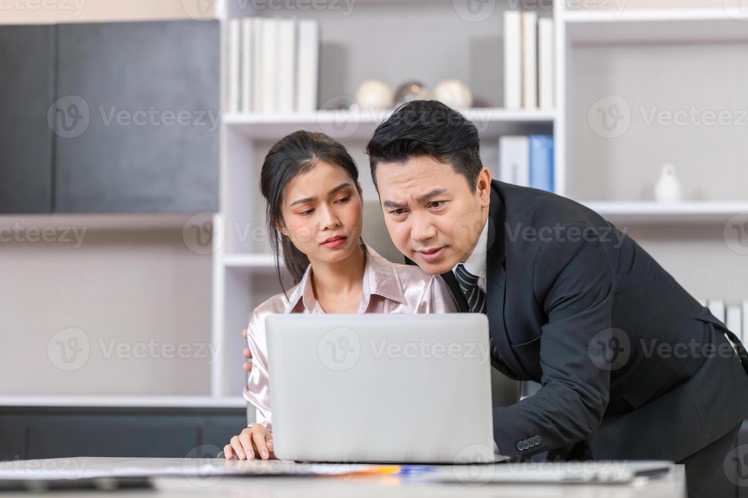 Manager and secretary working in the office photo