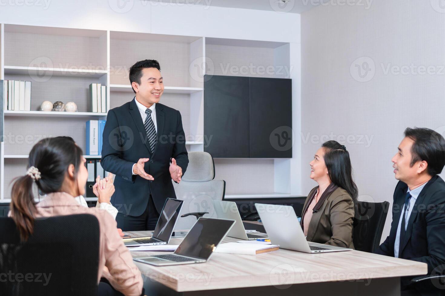 Group of coworkers in conference room during meeting, Business people in board room meeting at the office photo