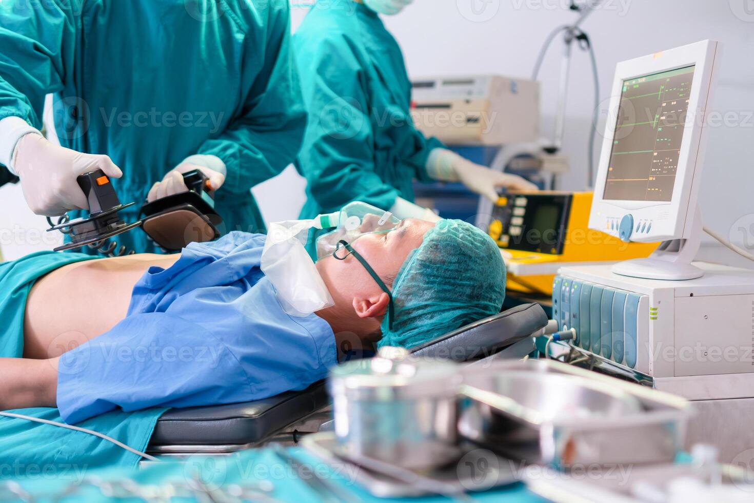 Medical team performing a surgical operation in the operating Room, Concentrated surgical team operating a patient photo