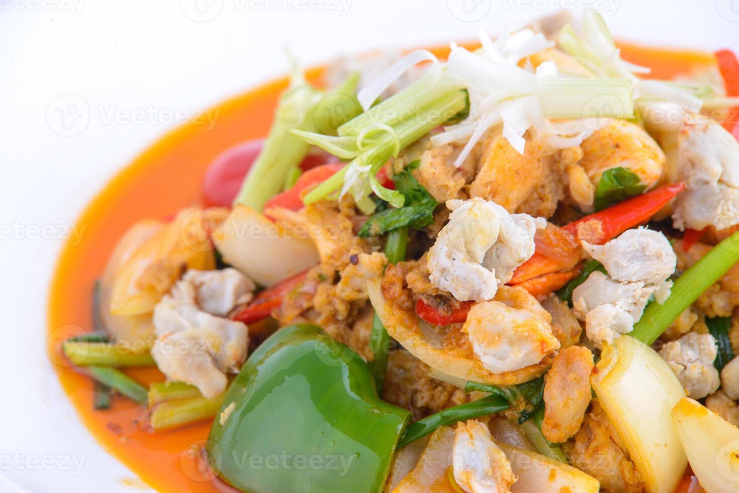 Sweet and sour crab stir fried on the white dish. photo